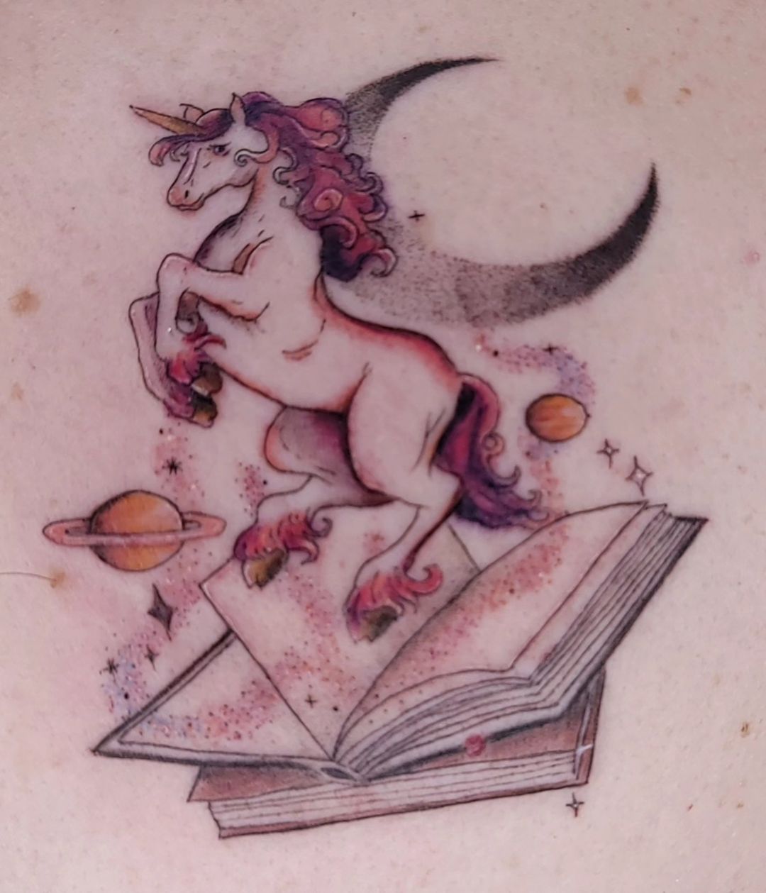 watercolor book tattoo by shirarte.tattoo