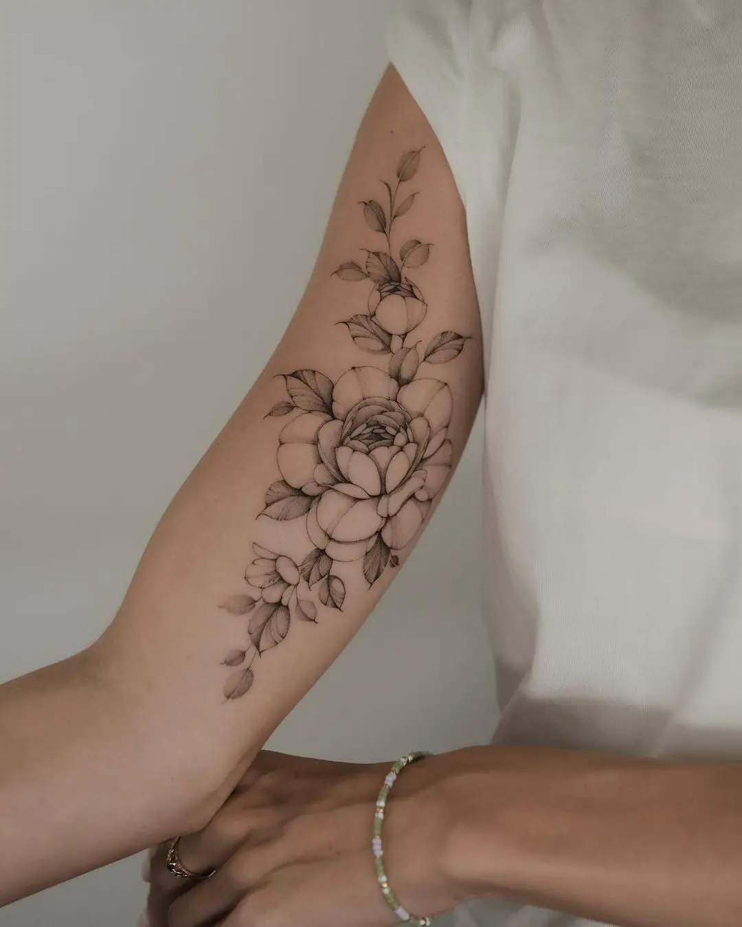 Peony tattoo on arm by asya.tattoo