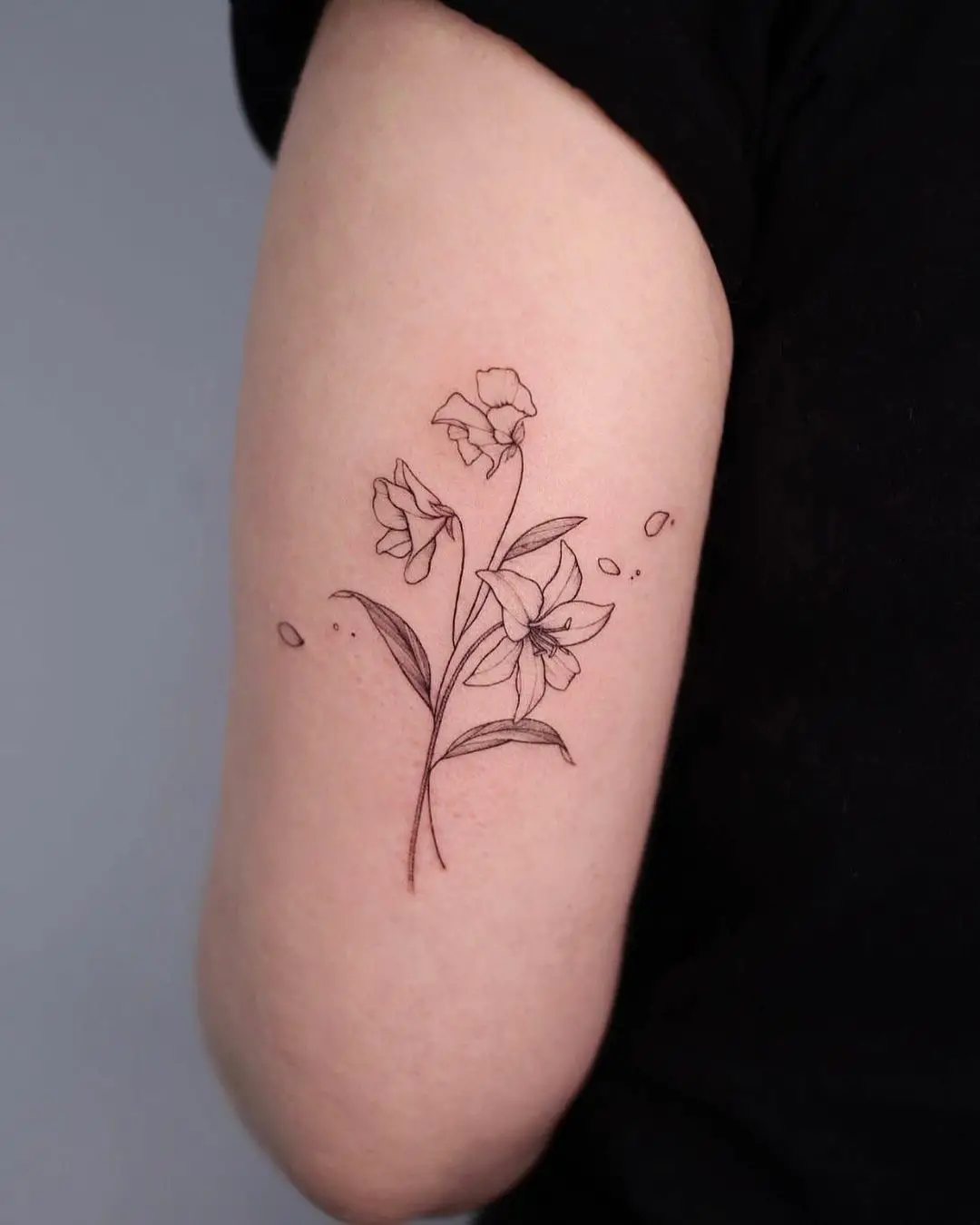 Small lily tattoo design by yeowool tattooer