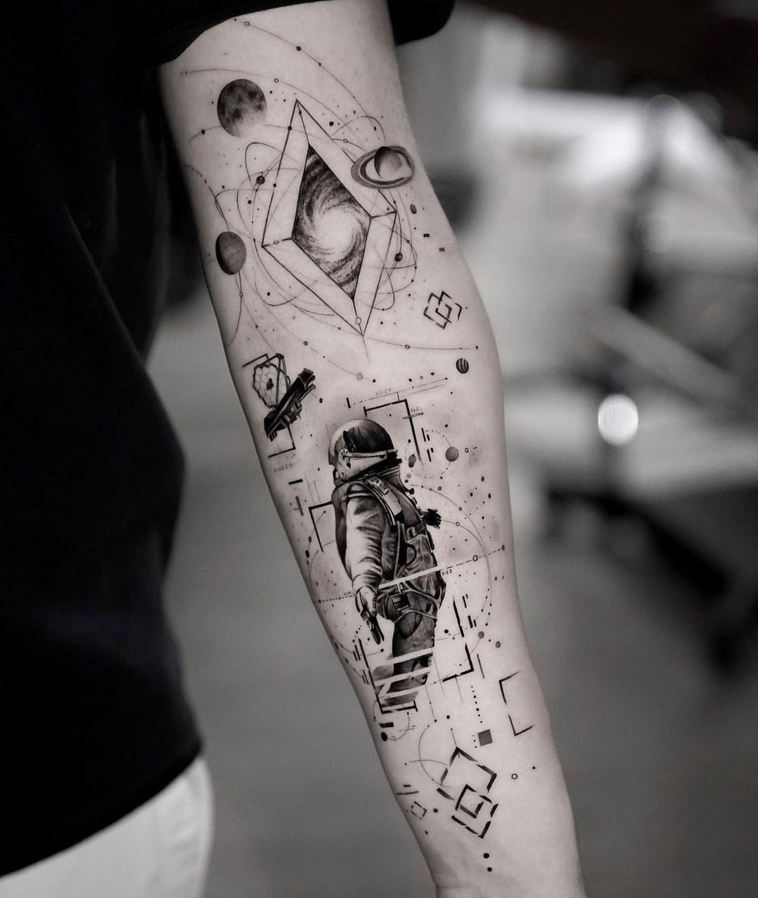 astranaut tattoo on arm by hood.seven