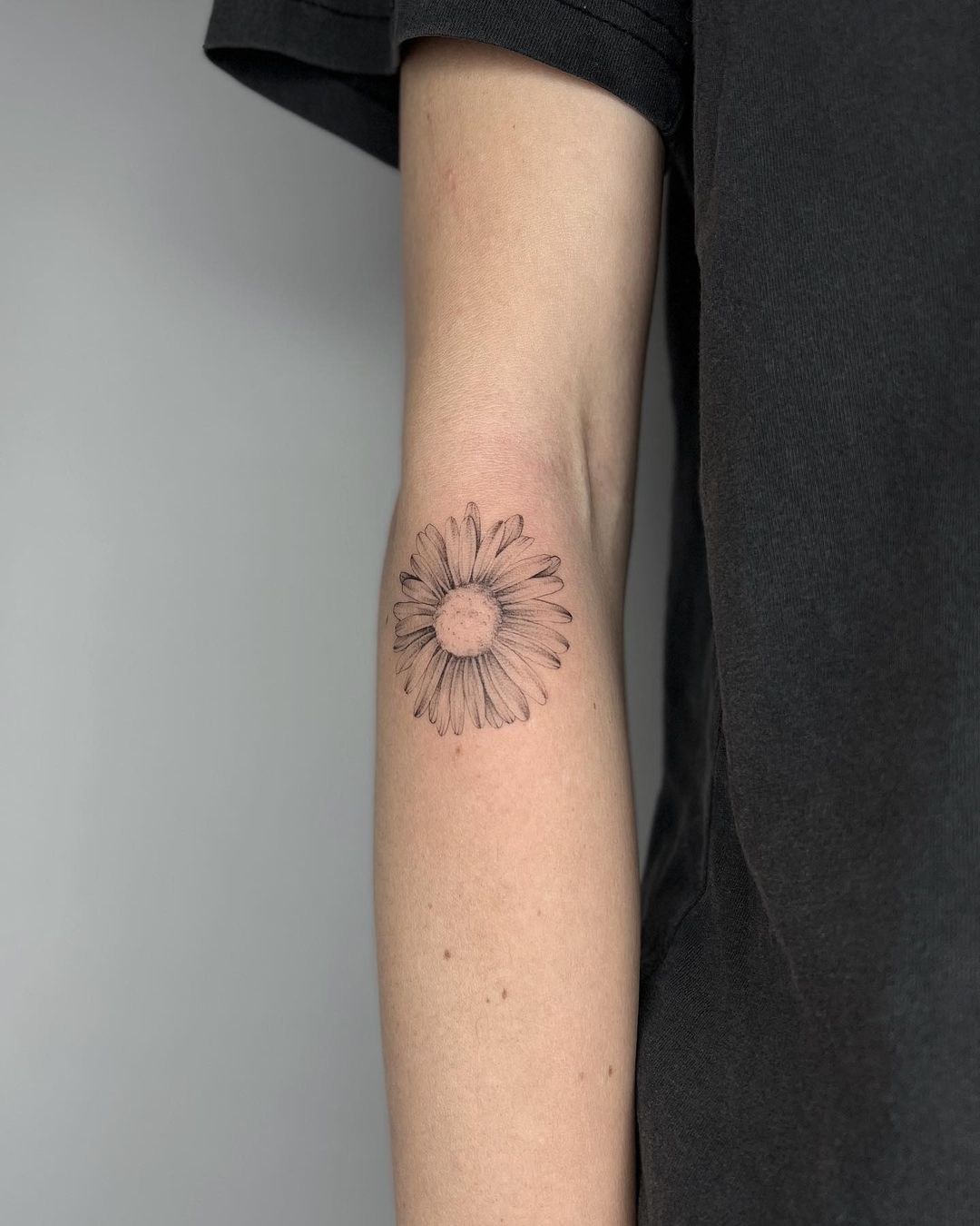 black and gray daisy tattoo design by soulpurposetattoo