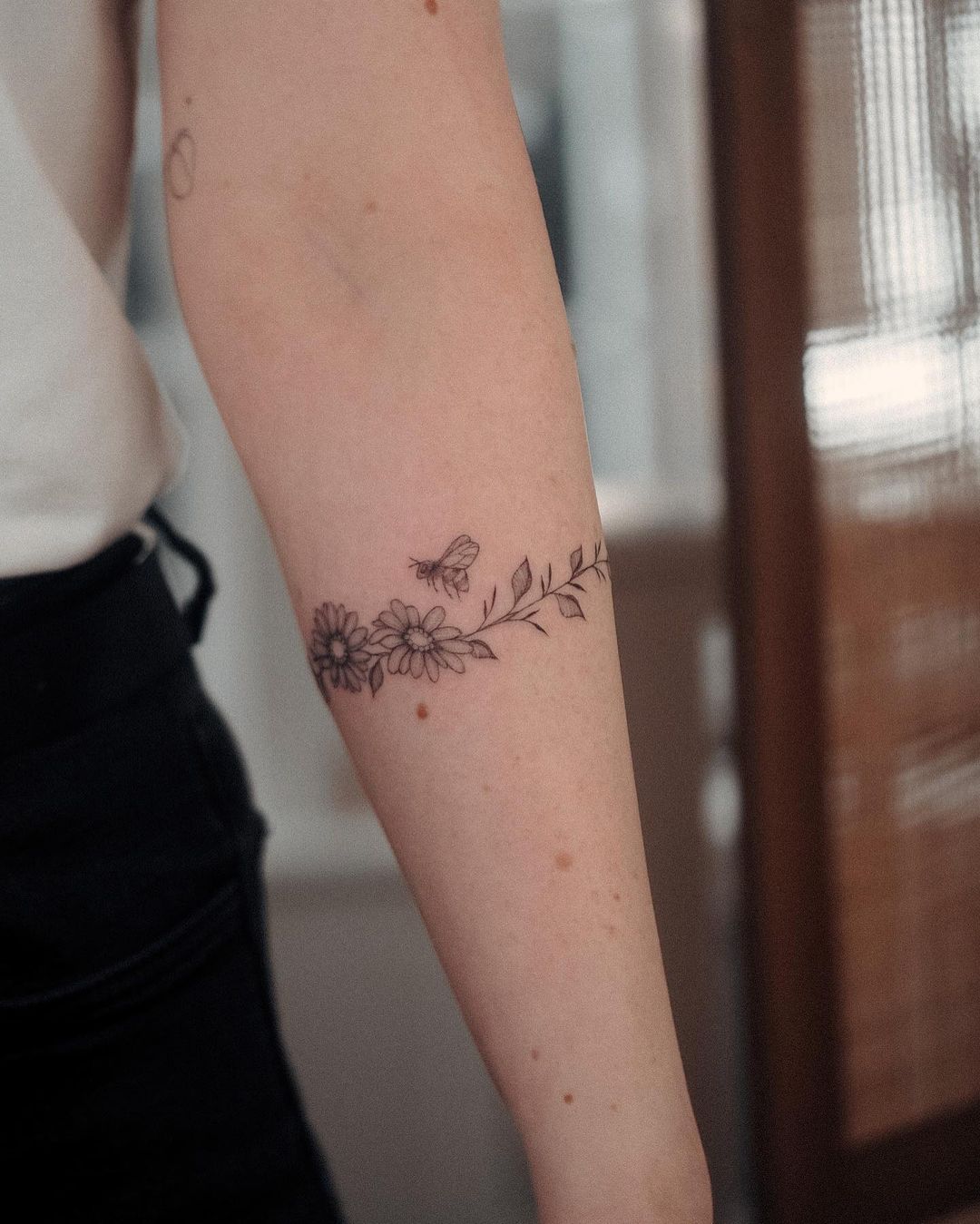 black inked flower tattoo by bunami.ink