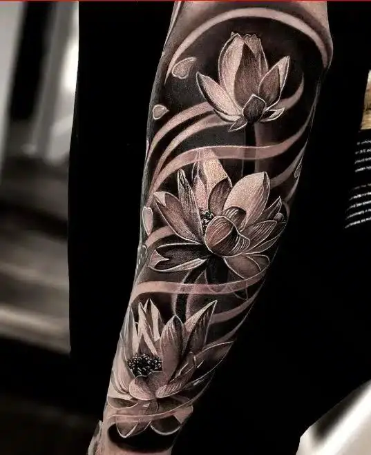 black inked lily flower tattoo