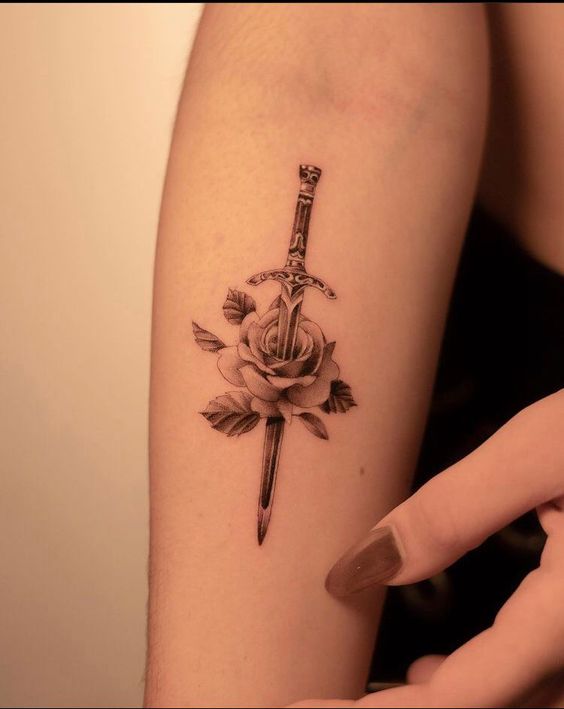 black inked sword tattoos