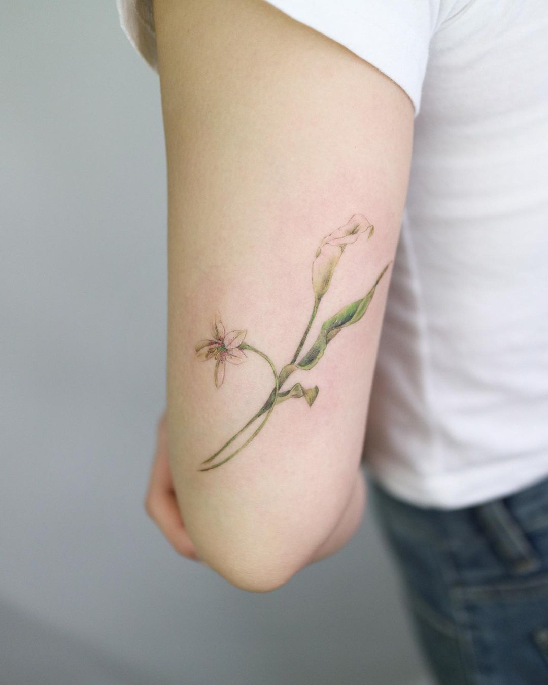 cute little flower tattoo by rhamone tattoo