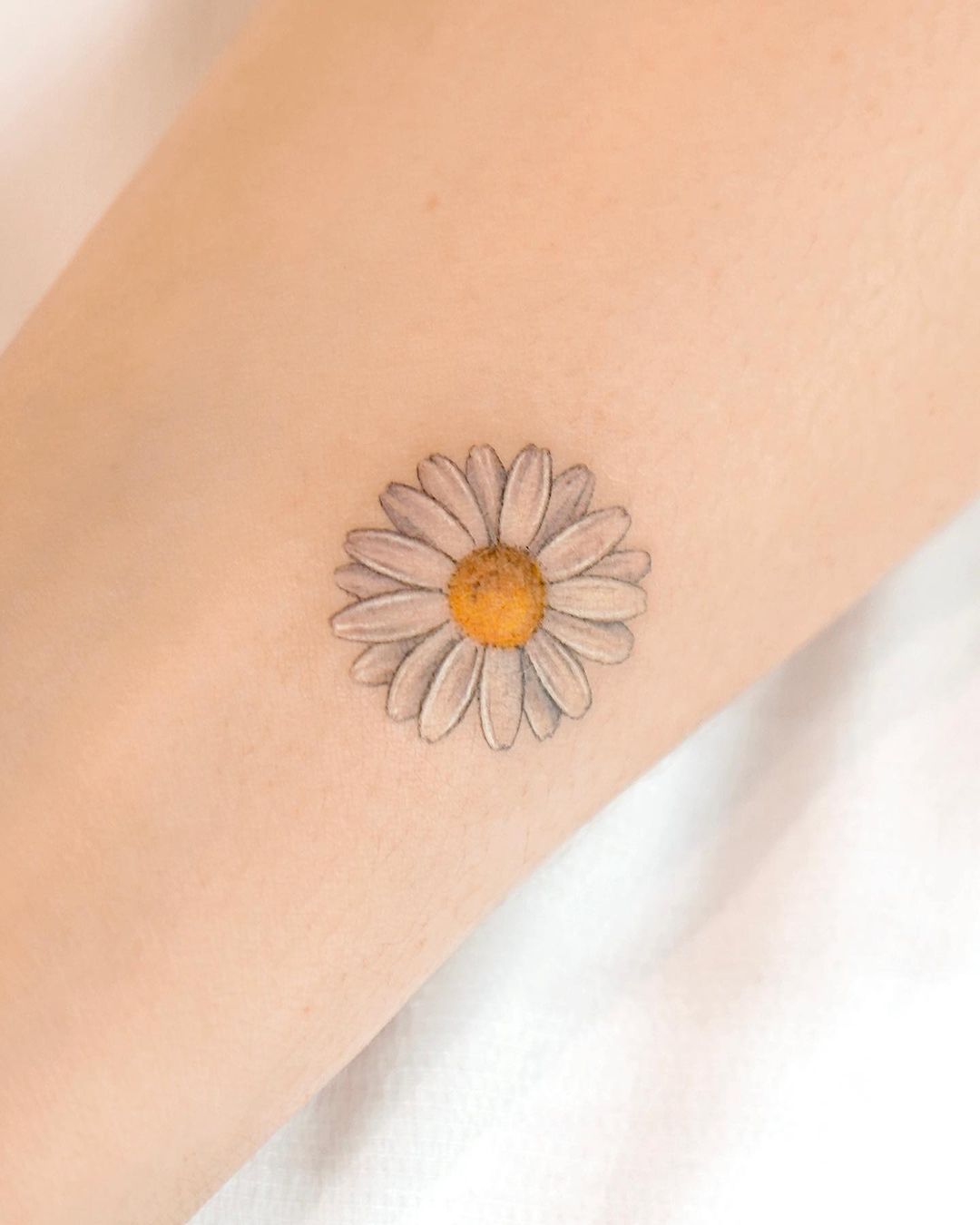 daisy tattoo for women by youngchickentattoo