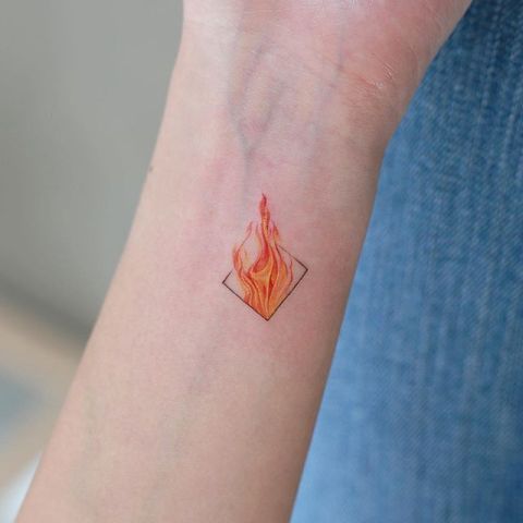 fire on forearm tattoo