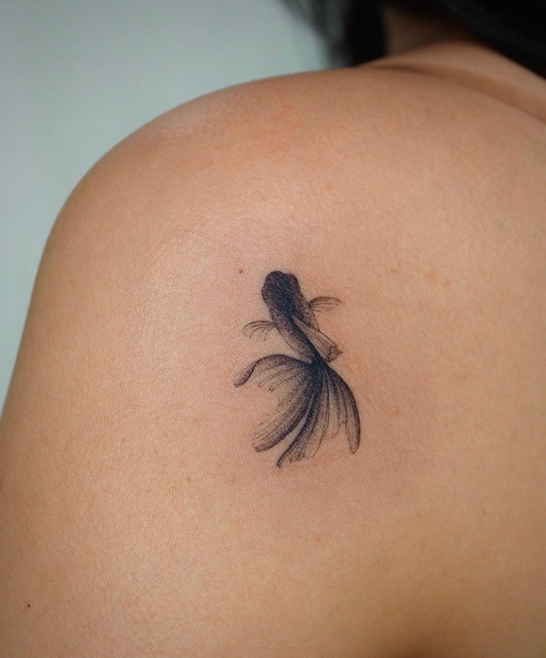 fish tattoo on shoulder by eunyutattoo
