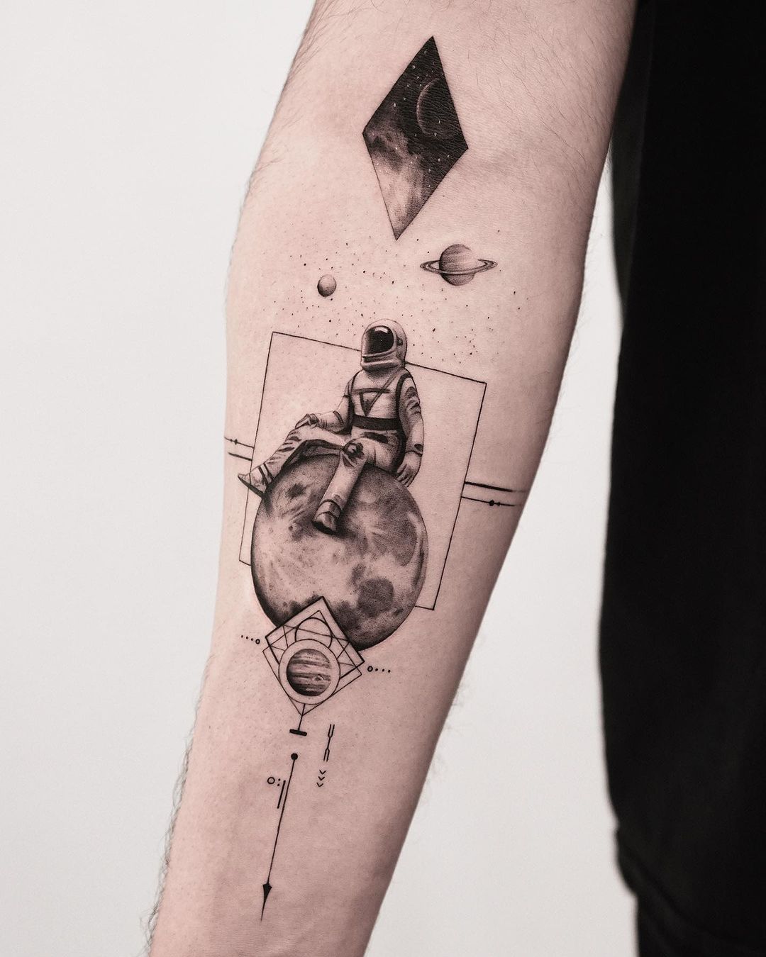 geometric astronaut tattoo design by kidneedle tattoo