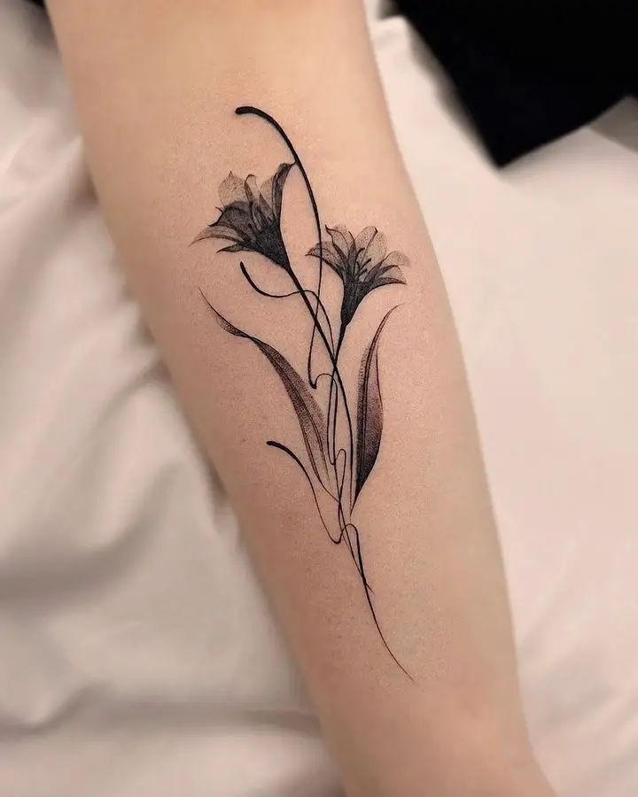 lily flower on forearm by tattooist hoji