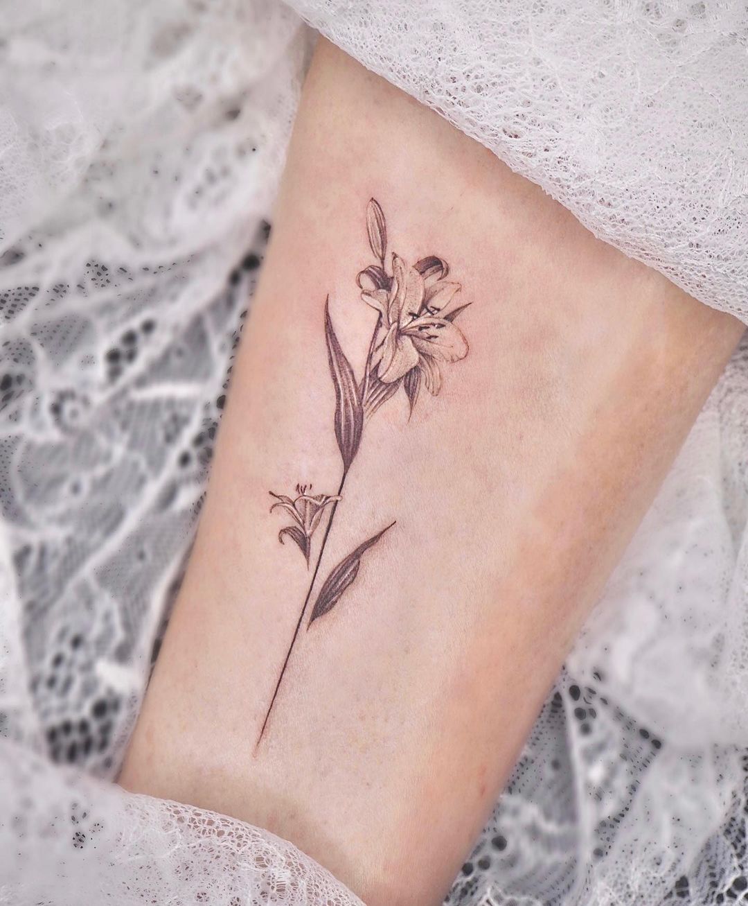 lily on forearm tattoo design by mariink.tattoos