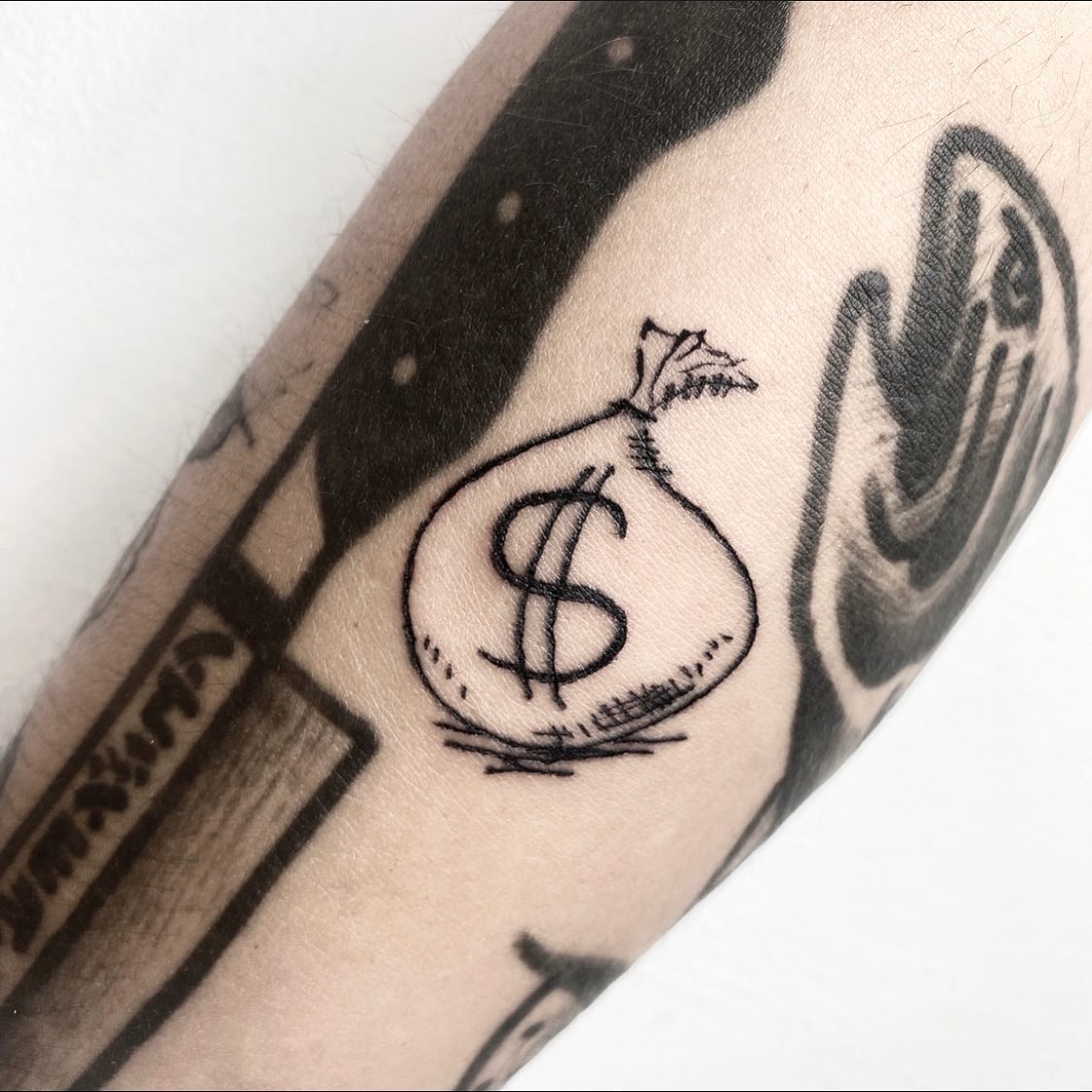 money bag tattoos by dk tattoo omn