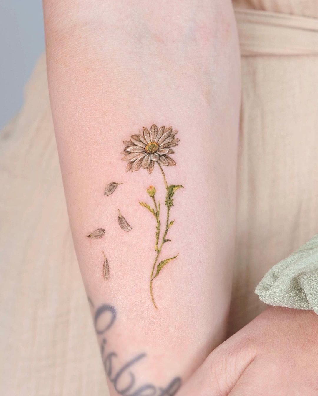 simple flower tattoo design by tilda tattoo