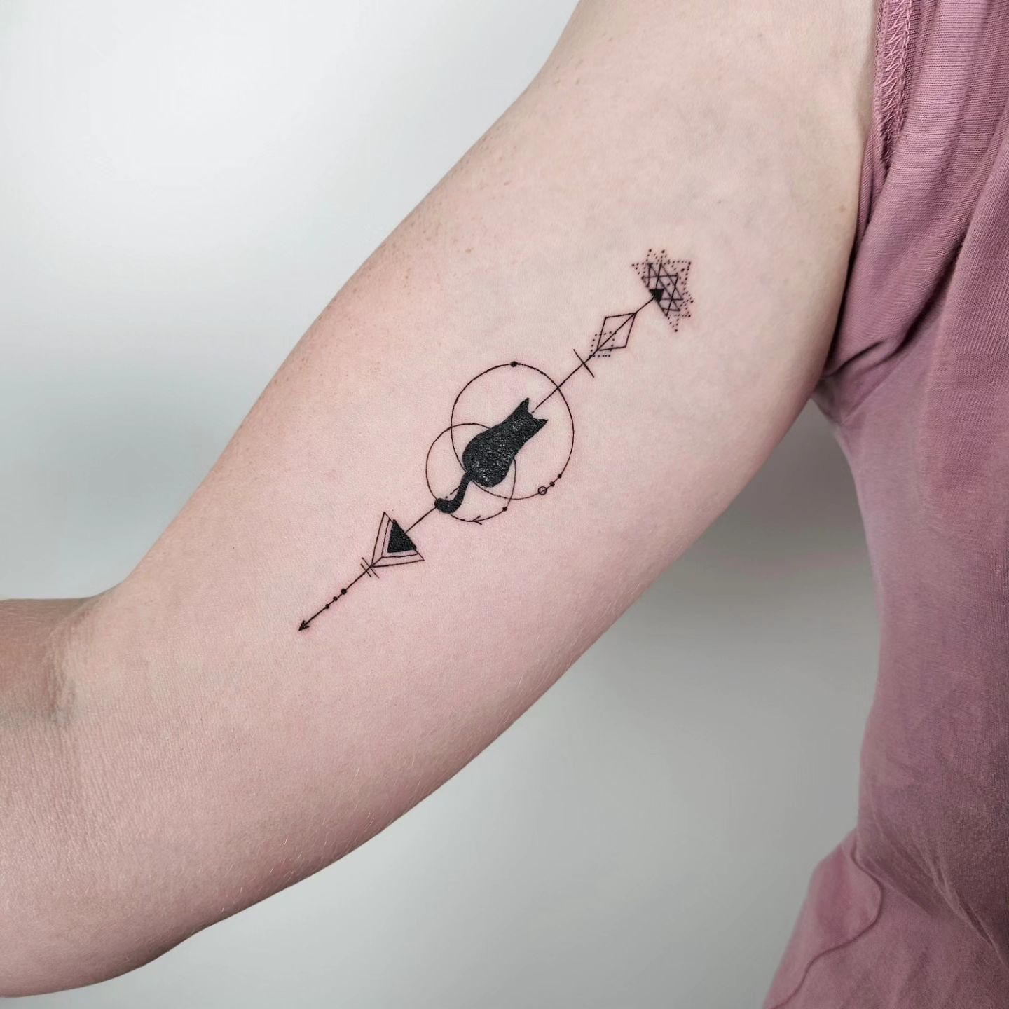 small geometric tattoo on arm by phuphi artwork