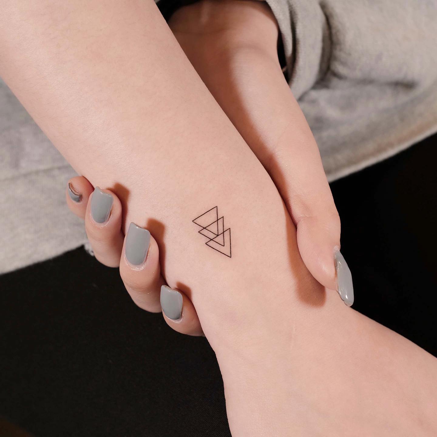 small triangle tattoo by nemo.tattoo