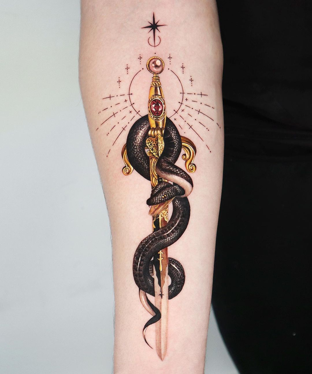 snake and sword tattoo by jooa tattoo