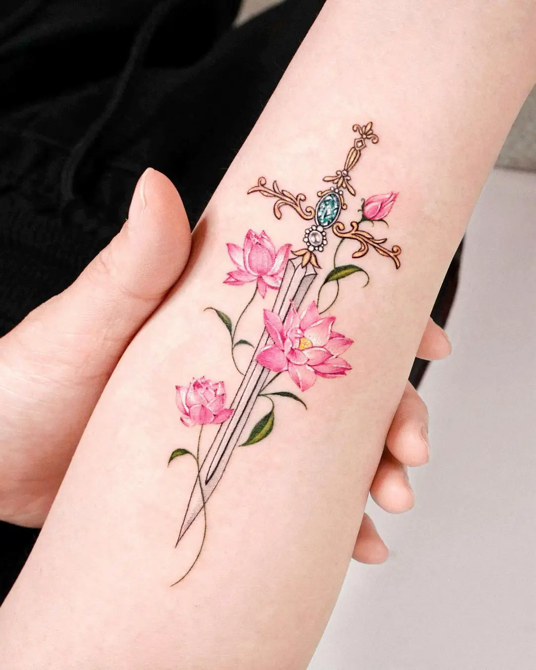 sword tattoo ideas for women by tattooist solar
