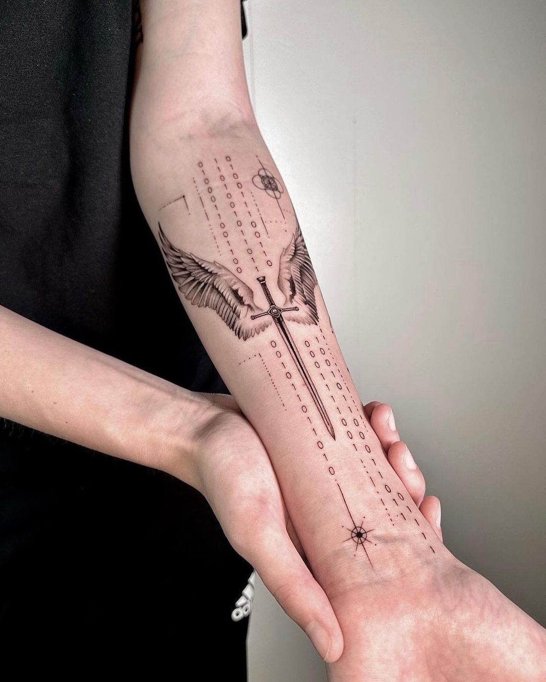 sword tattoo on arm by