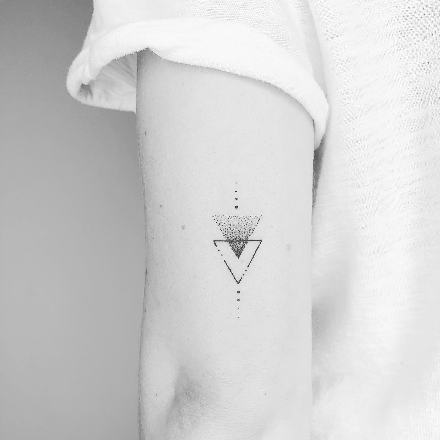 tiny triangle tattoo by finelinetattooantwerpen