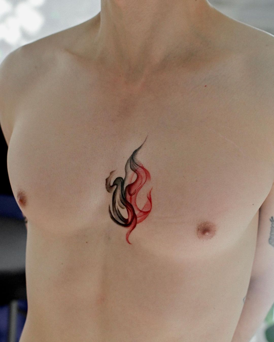 watercolor fire tattoo design on chest by joytattoo