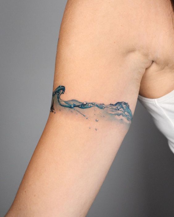 watercolor mountain and wave tattoo