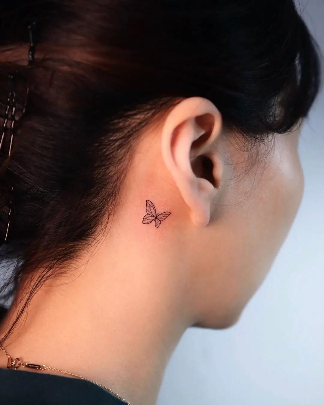 Butterfly behind ear tattoos by yeowool tattooer