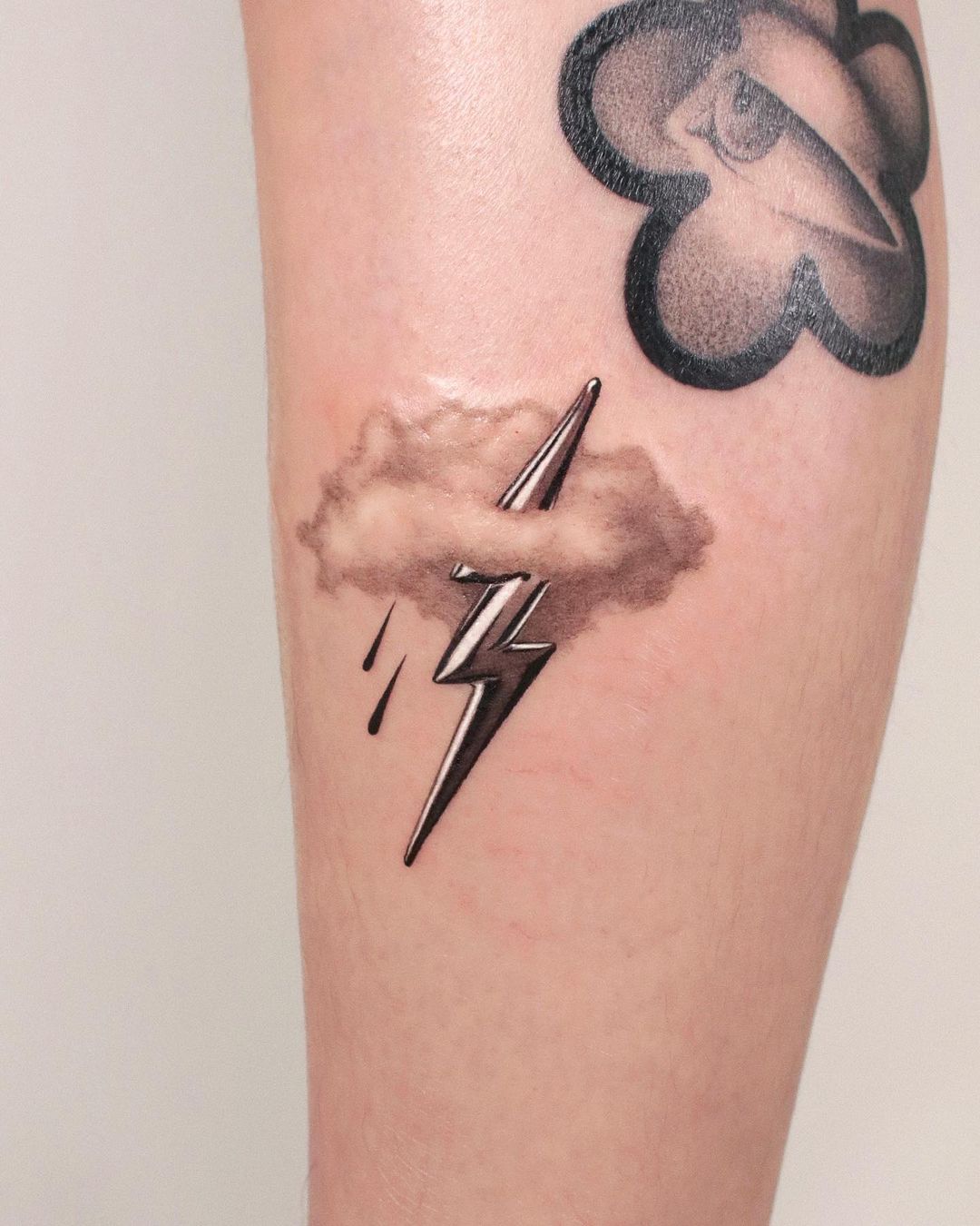 Cloud tattoos on forearm by shooin.tattoo