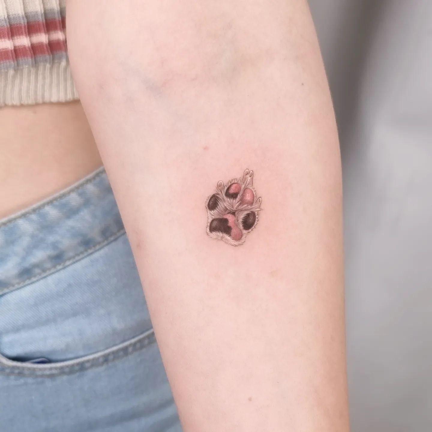 Cute paw tattoo by tattoooist sazin