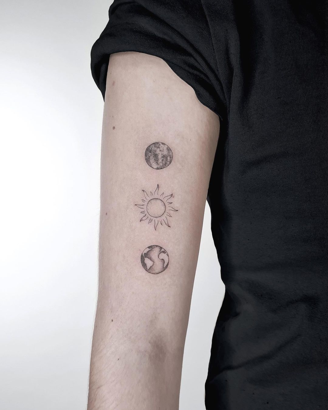 earth tattoo for men by cado.tattoo