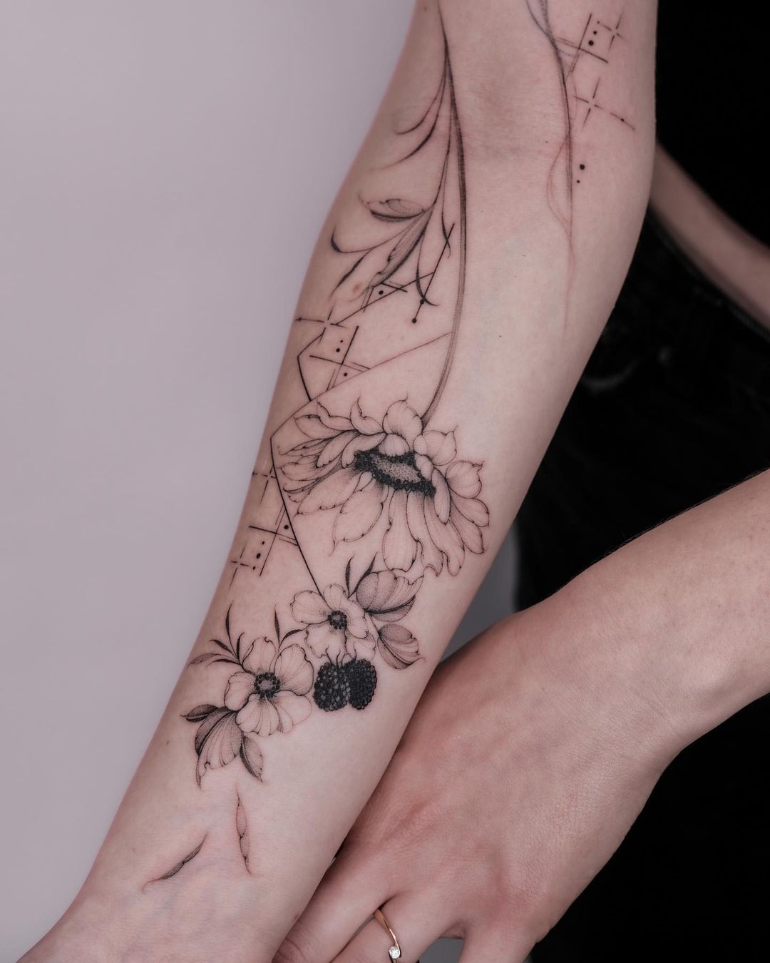 flower tattoo on forearm by lasstattoo