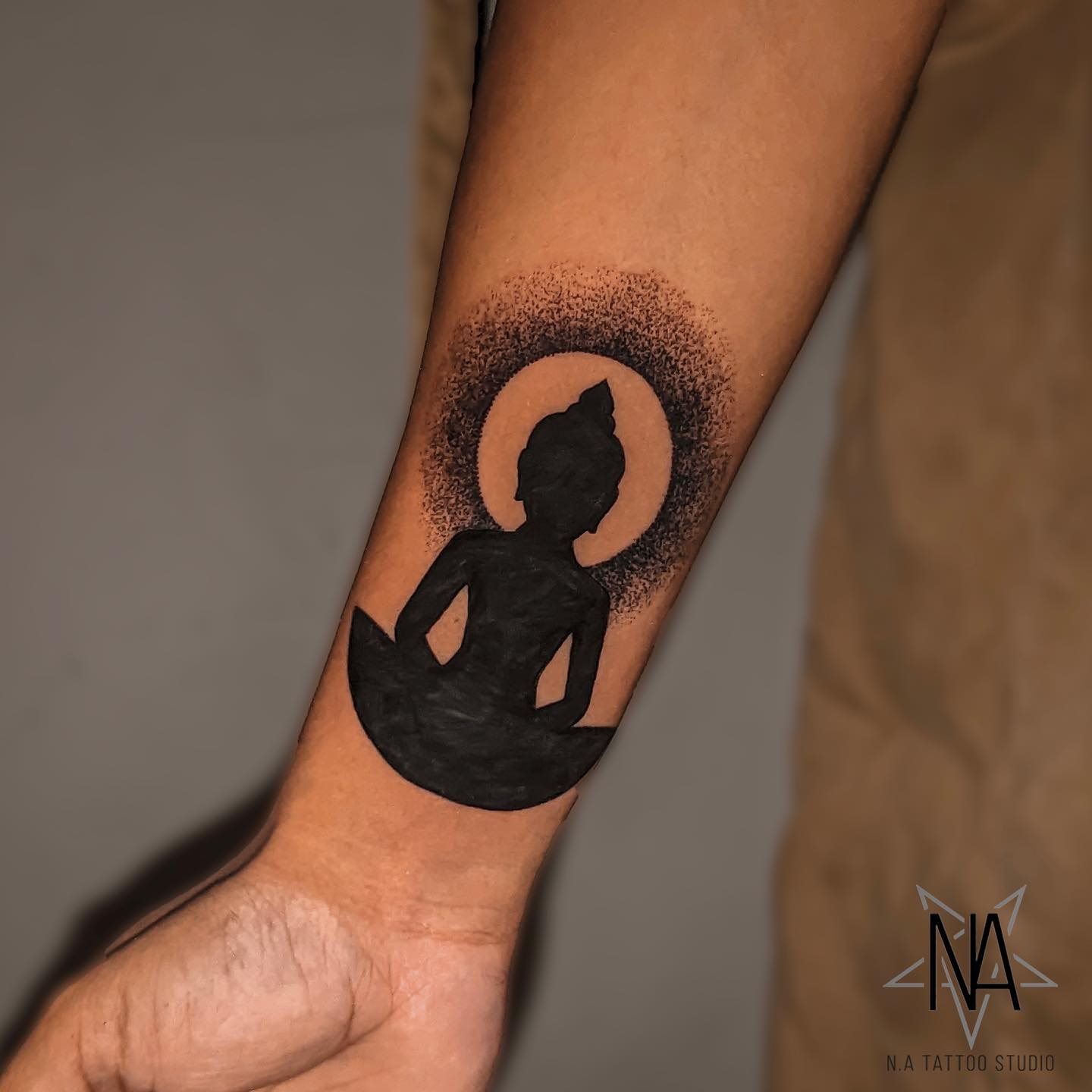 forearm buddha tattoo idea by natattoostudio