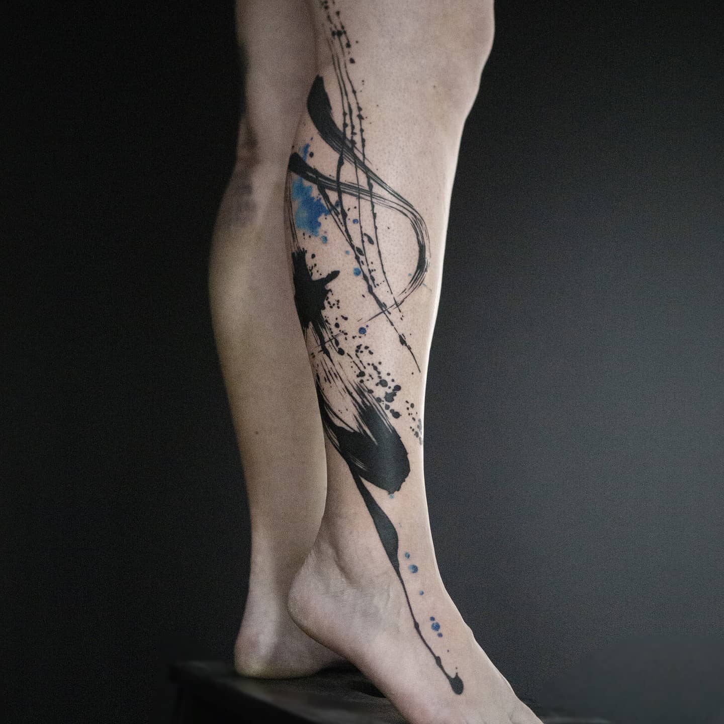 Abstract lower leg tattoo by lina