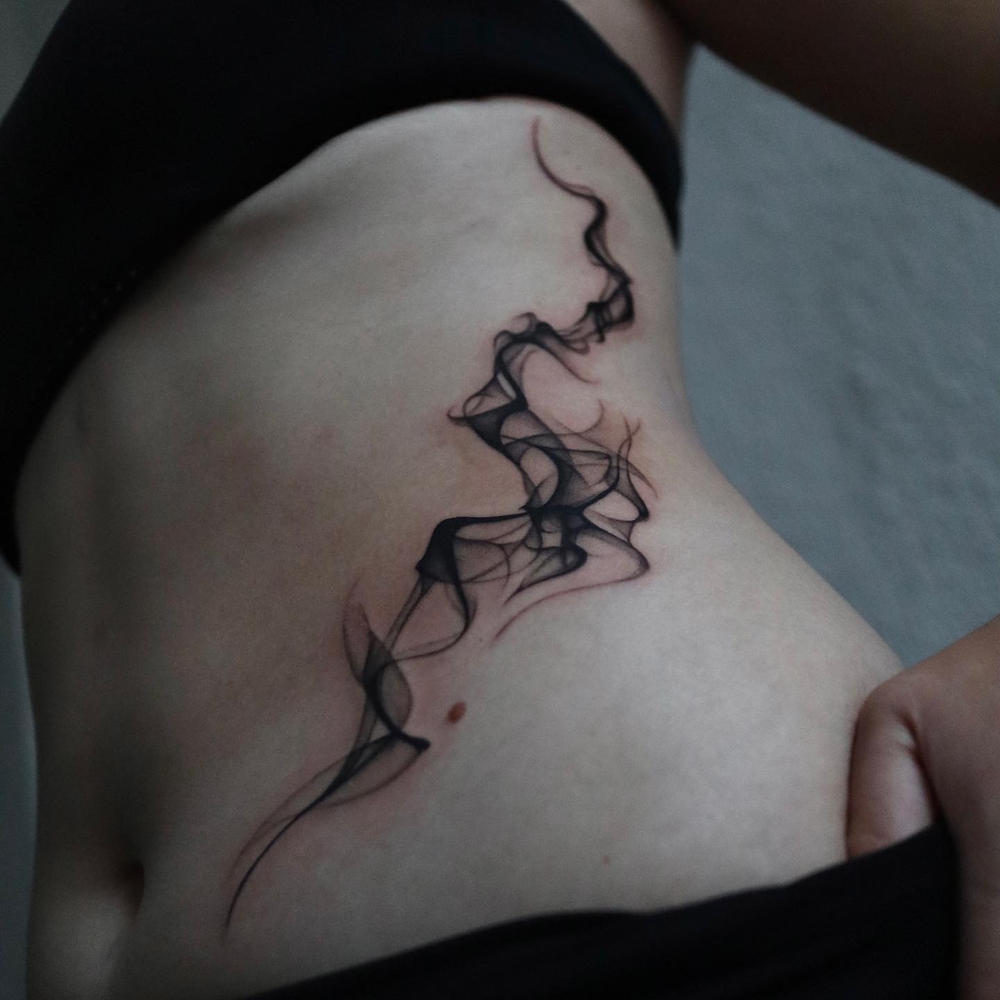 Abstract ribs tattoos by