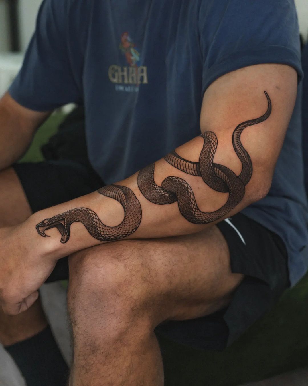 Amazing sanke tattoo on arm by koonoblk