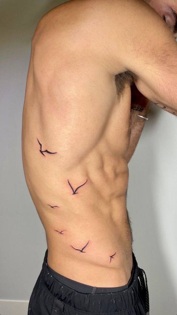 Bird ribs tattoos for men