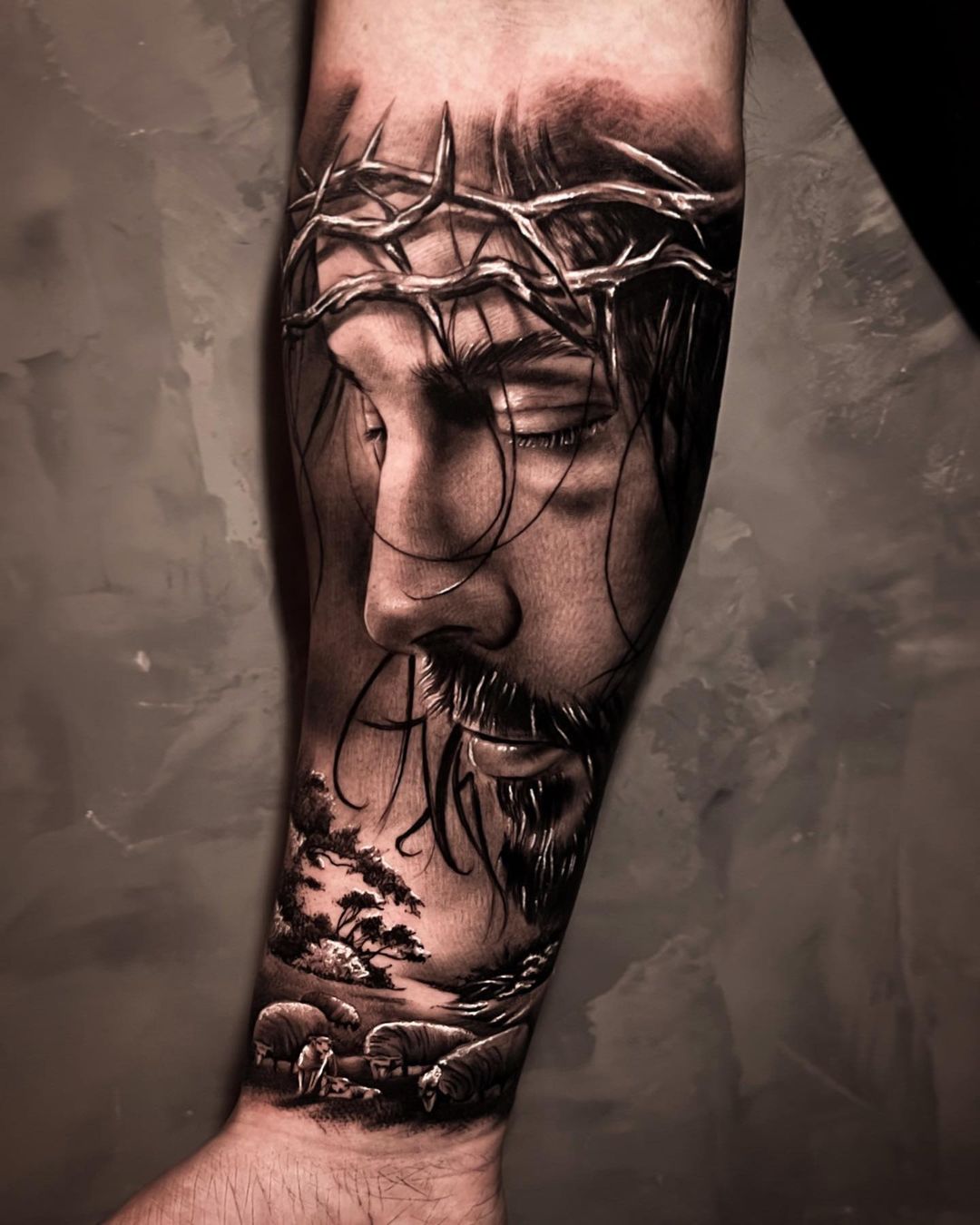 Jesus tattoo on arm by