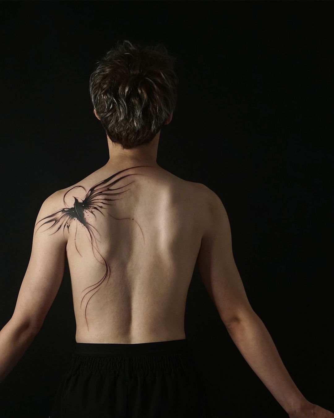 Phoenix on back tattoo by tattooist.pado