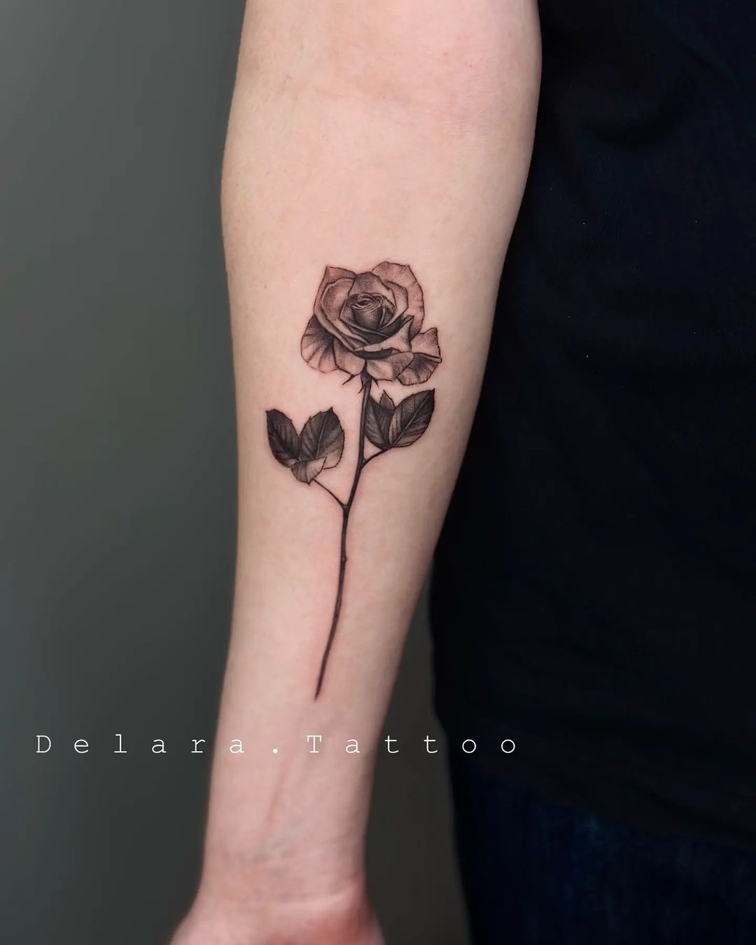 Rose on arm tattoo by delara.tattoo
