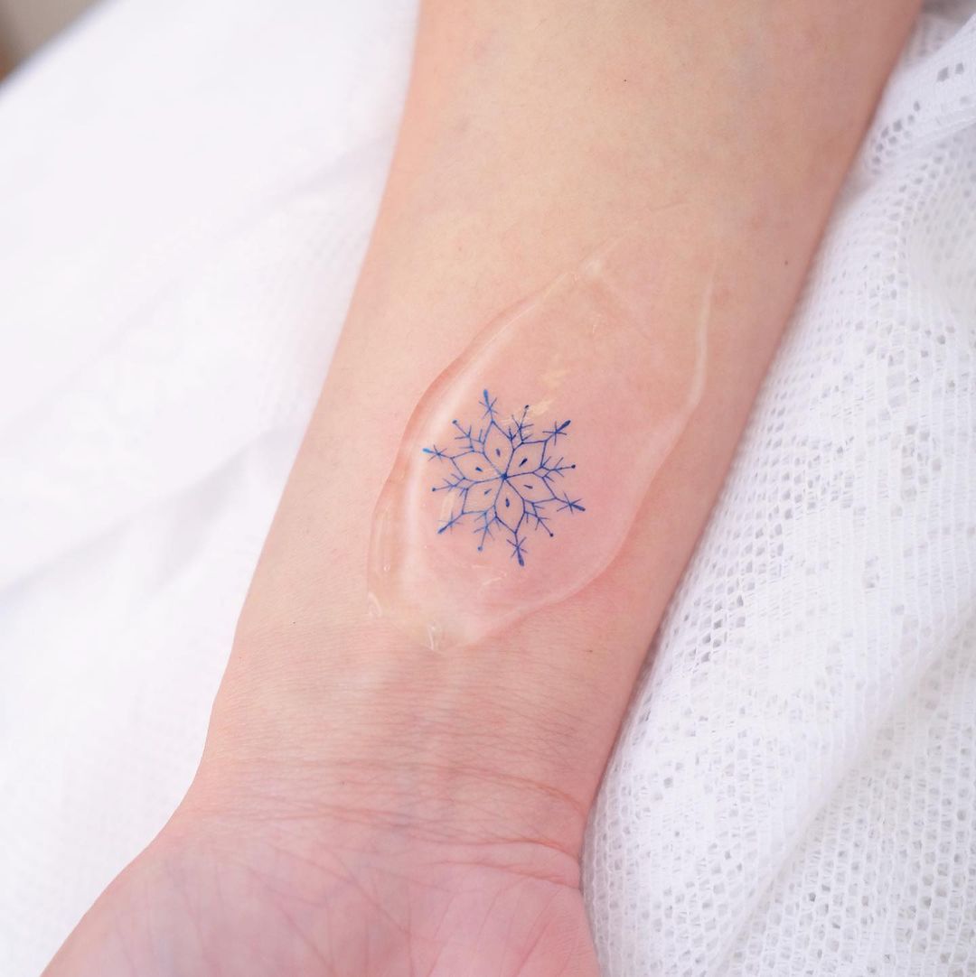 Snowflake tattoos by hktattoo tina