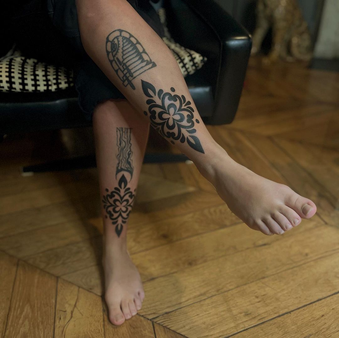 Tribal leg tattoo for men by