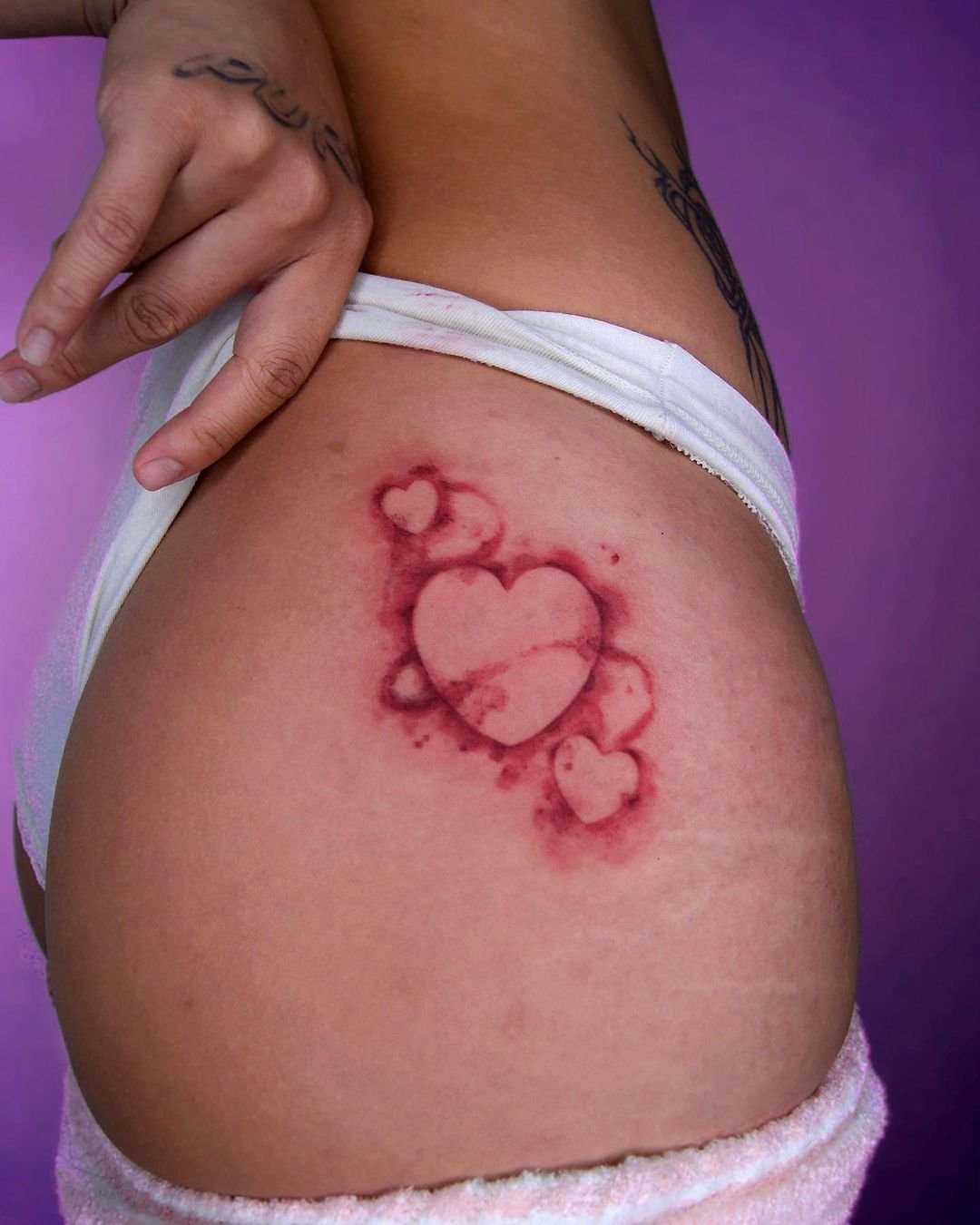 airbrush heart tattoo by kitsch tattooer