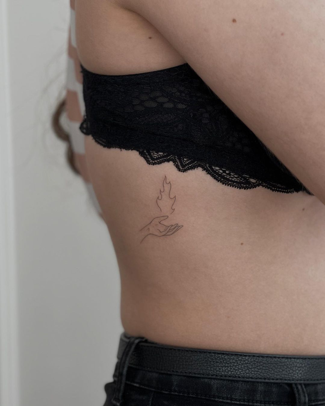 finelnie tattoo on rib by dawidroszak tattoo