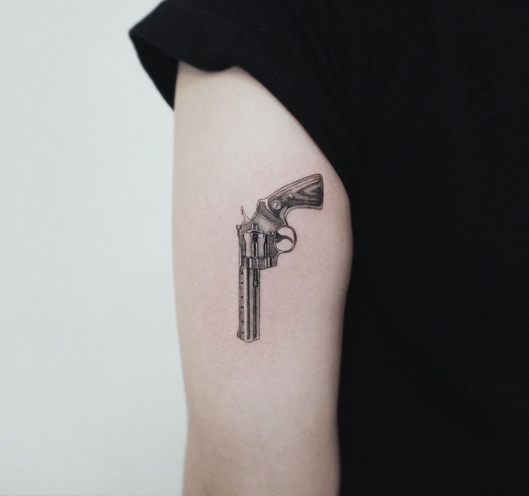 gun tattoo for men by zeal tattoo