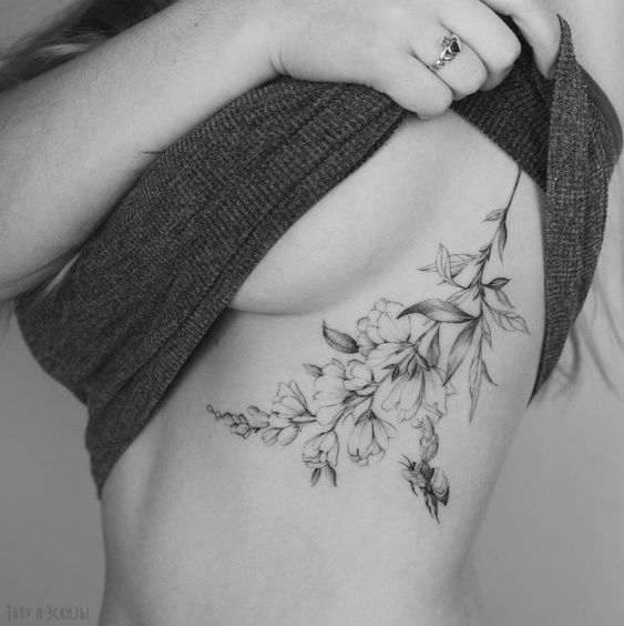 rose tattoo design on ribs