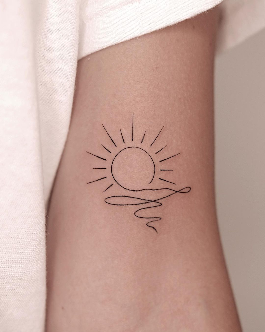 simple sun tattoo for men by isoltattoo
