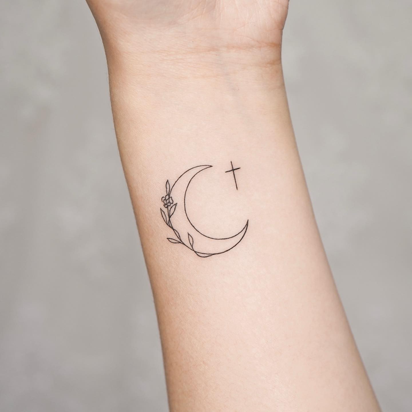 small cross tattoo with moon by simya tattoo