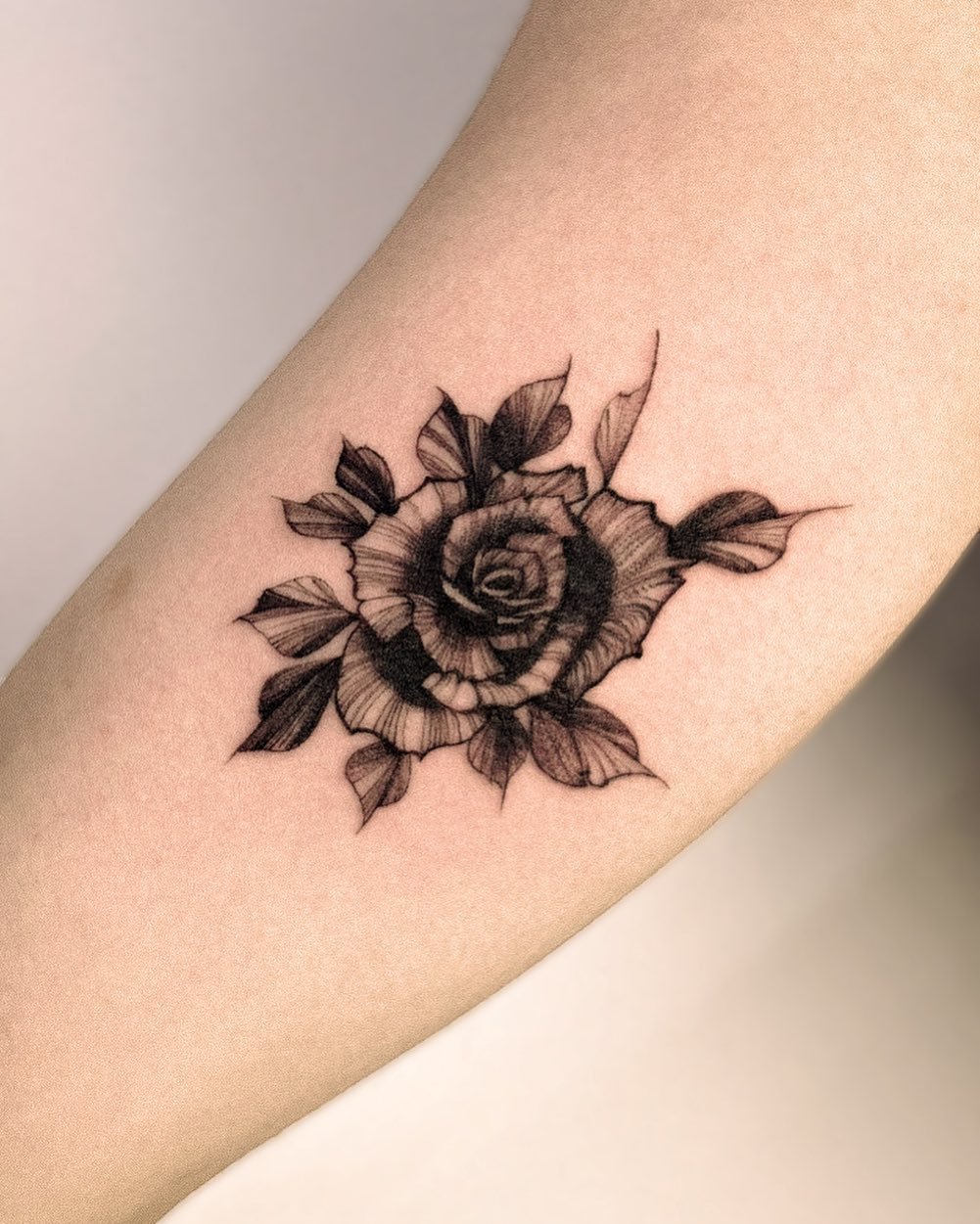 small flower tattoo by tattooist hoji