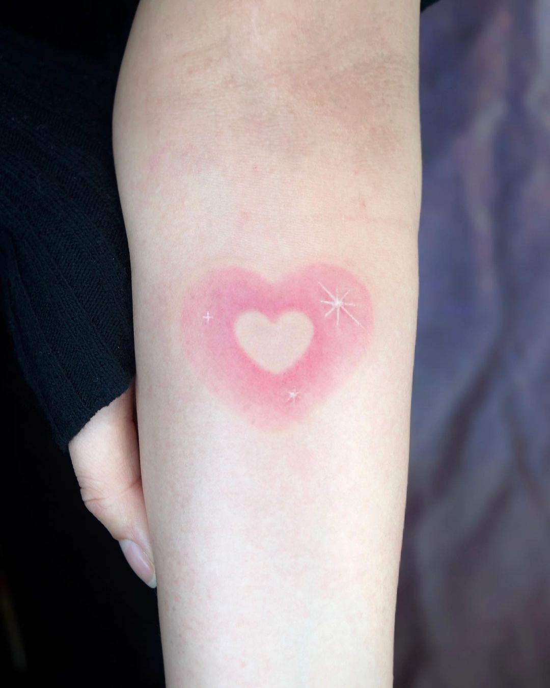 small heart design by kitsch tattooer