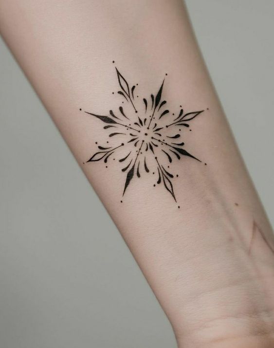 Black ink snowflake tattoo for men
