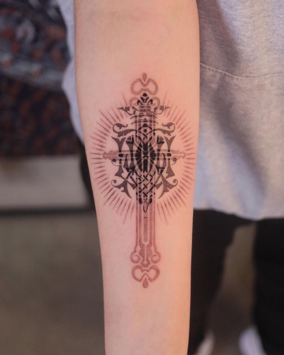 Realisti cross tattoo by tattooist ato